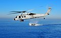 (Dec. 6, 2008) An MH-60S flies over a LCAC from the USS New Orleans (LPD 18).jpg