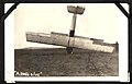 "A NOSE DIVE"- photograph of an aircraft which has landed on its nose, with a man at the right hand side of the shot, holding the wing. (7980822413).jpg